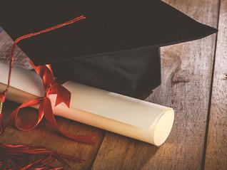 Graduation hat and diploma